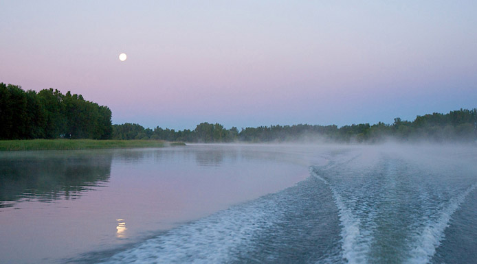 Full moon refecting on water.